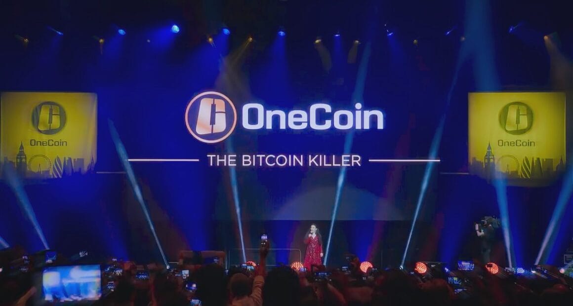 OneCoin event with Ruja Ignatova on stage, promoting the scam as "The Bitcoin Killer".