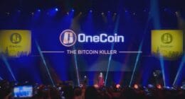 OneCoin event with Ruja Ignatova on stage, promoting the scam as "The Bitcoin Killer".
