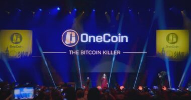 OneCoin event with Ruja Ignatova on stage, promoting the scam as "The Bitcoin Killer".