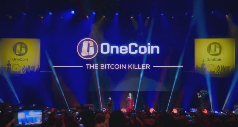 OneCoin event with Ruja Ignatova on stage, promoting the scam as "The Bitcoin Killer".